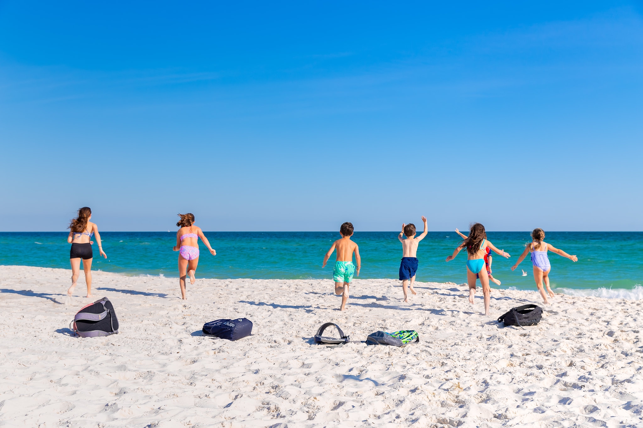 Family enjoying the beach in Gulf Shores Alabama with kids during summer vacation