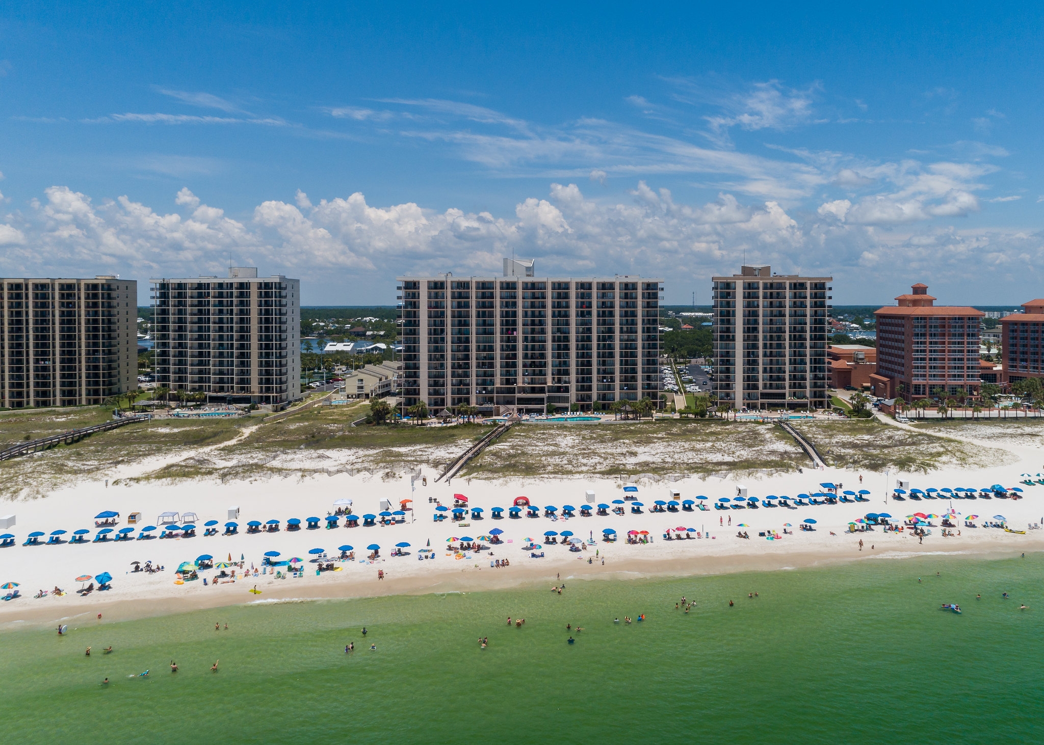 Beautiful Gulf Shores beach with soft waves and clear skies
