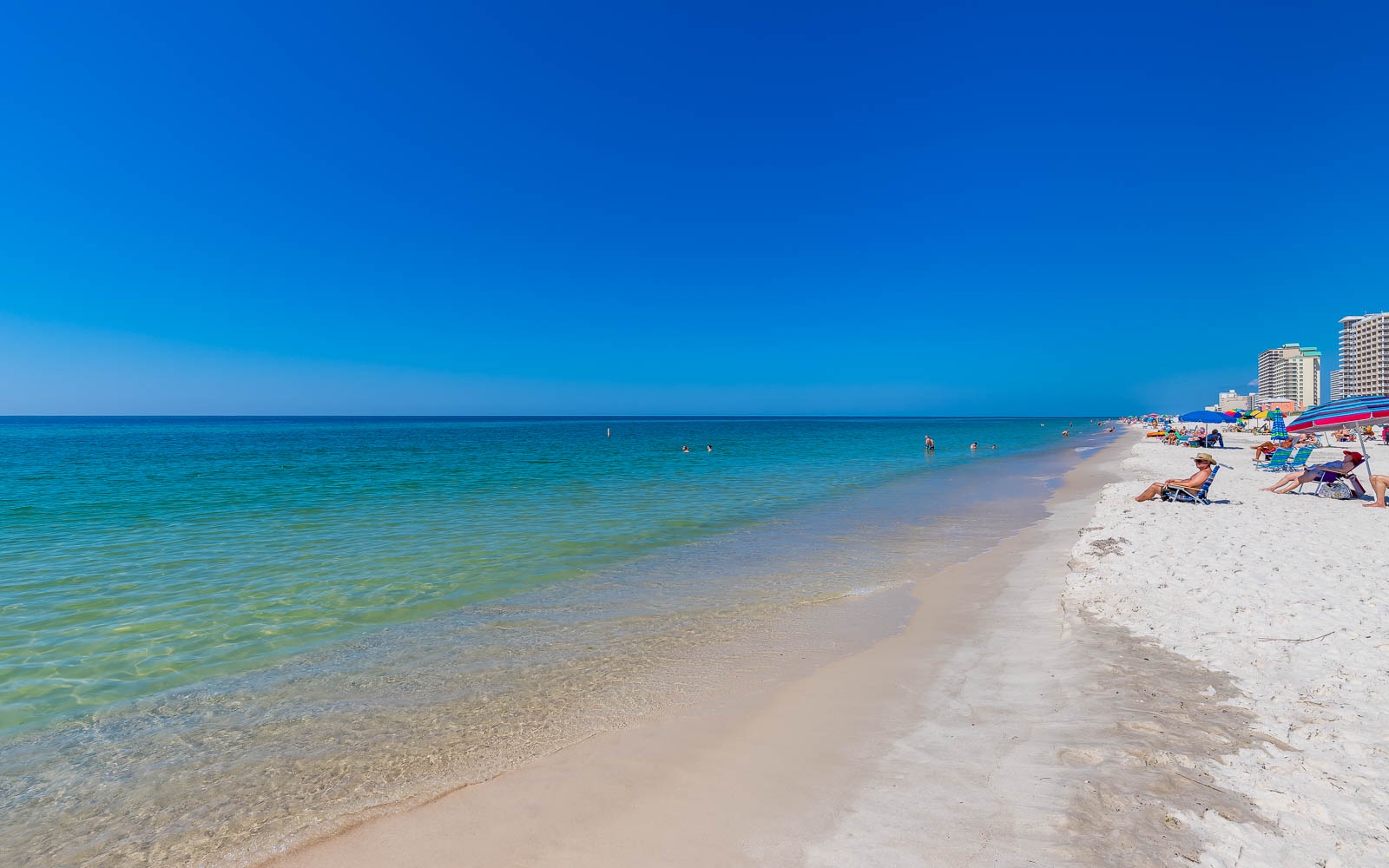Gulf water along a white-sand beach