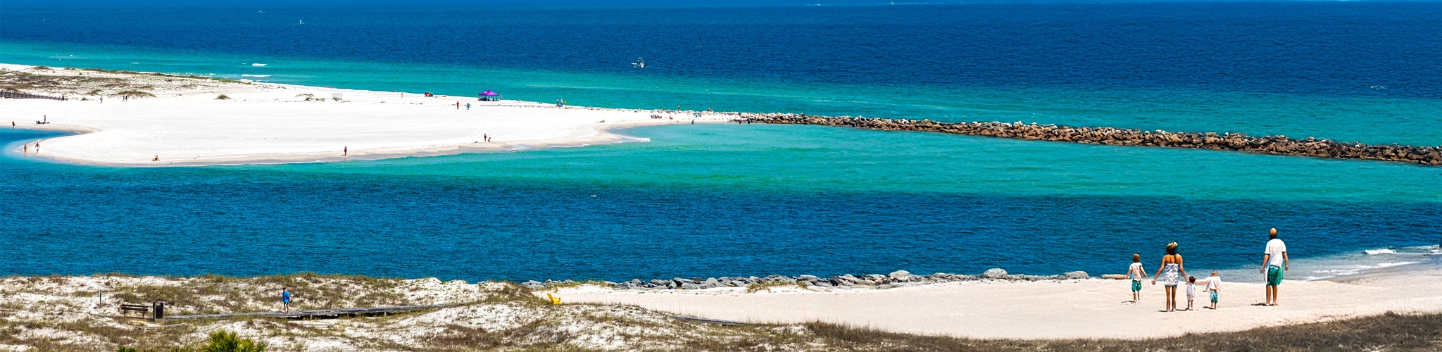 White-sand shoreline beside clear coastal water