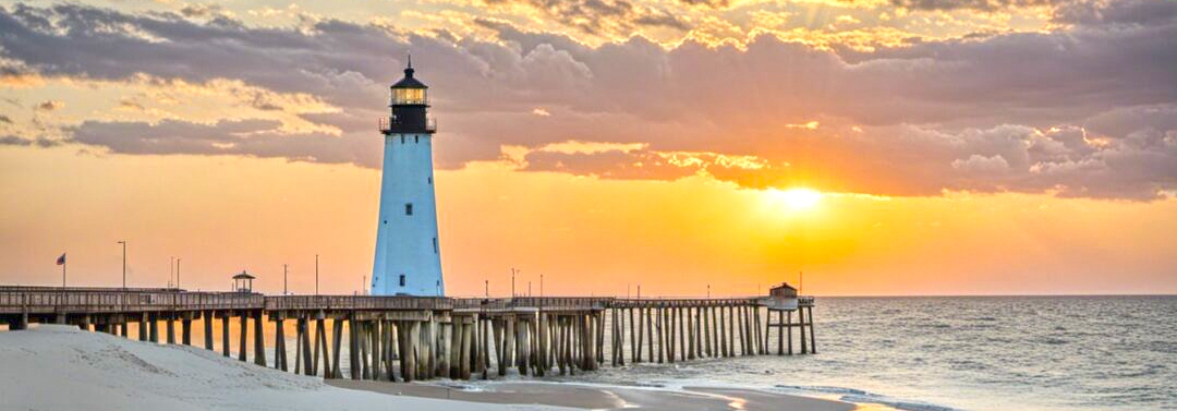 Coastal lighthouse at sunset