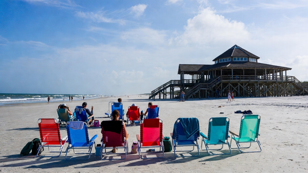 Beach seating overlooking a waterfront pavilion