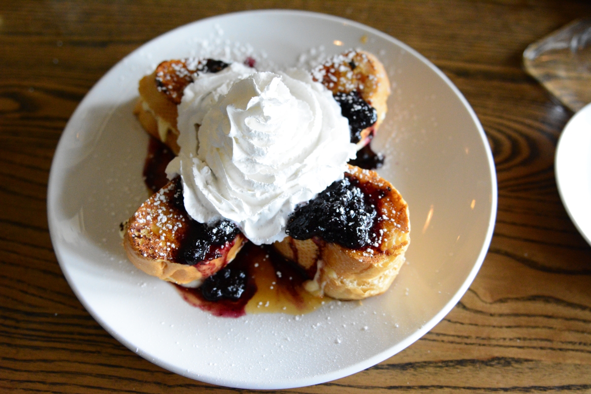 French toast topped with cream and fruit at Brick and Spoon