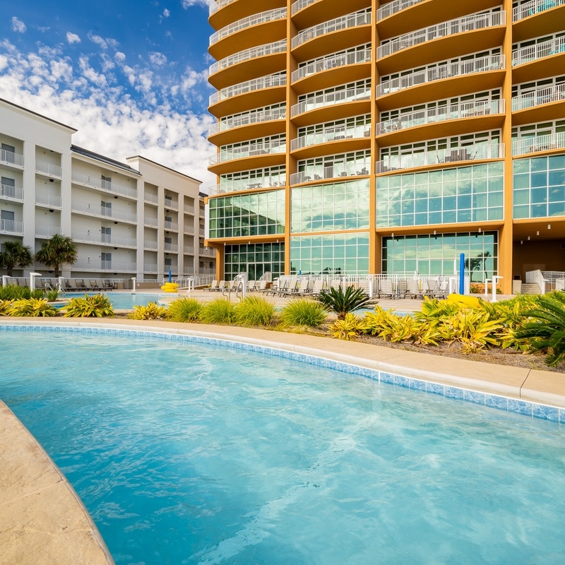 Outdoor pool beside beachfront condos